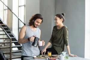 Morning coffee family ritual: happy couple enjoying breakfast together to boost connection, energy, and joy