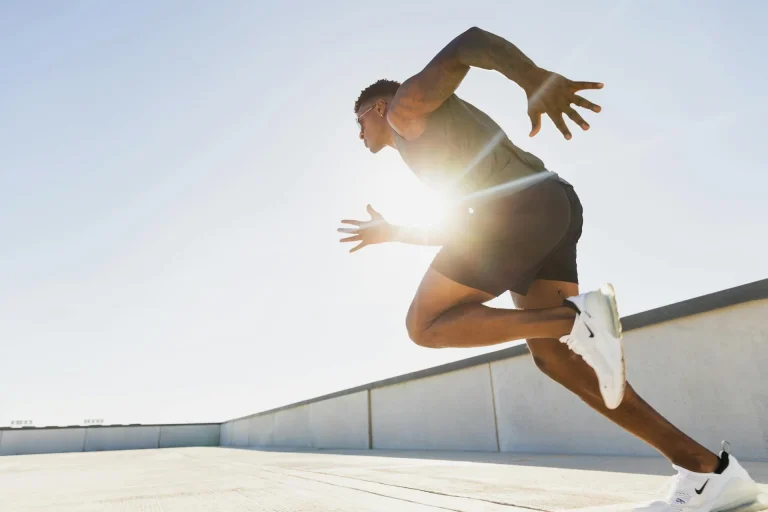 Athletic man running fast, symbolizing nitric oxide boosters for male performance and blood flow
