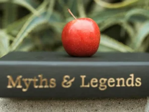 Testosterone boosters myths illustration showing book and apple highlighting men’s wellness and supplement facts 