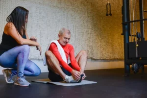 Man and woman working out together at home, staying active and supporting a healthy lifestyle with fitness 