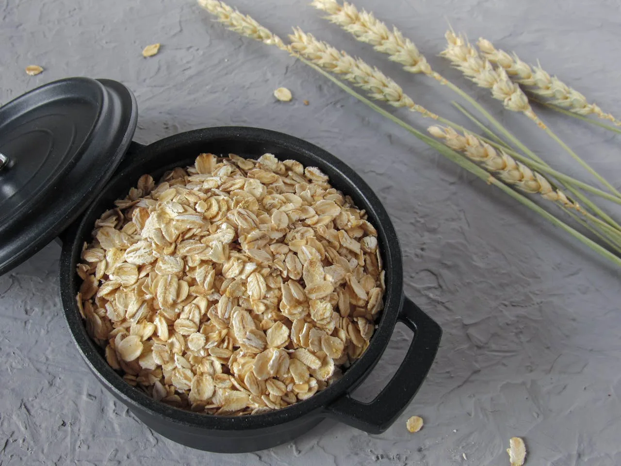 Gut Health for Daily Energy in Men with oatmeal bowl and oat grains rich in fiber supporting microbiome and digestion