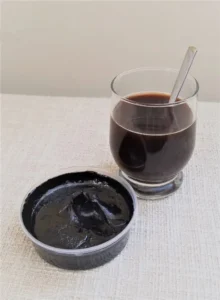 Shilajit and ashwagandha for men over 40: Altai Mumijo dissolved in water photo from Wikipedia for supplement article 