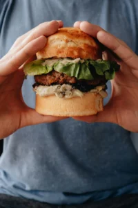 Image of a typical burger meal representing diet and lifestyle choices related to men's health and overall wellness 